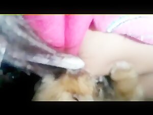 Teen feeds puppy